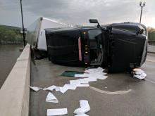 A truck is overturned on the Danville-Riverside bridge Tuesday. (Press Enterprise/Jimmy May)