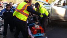 Rescuers remove Gina Limongelli, 46, of Hunlock Creek, from mangled wreckage of her Chevrolet Equinox following head-on collision with full-size GMC pickup in Orangeville Tuesday morning. The other driver, 20-year-old Evan Campbell of North Centre Township, was unhurt. (Press Enterprise/Leon Bogdan)