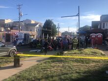 Susan Schwartz/Press Enterprise A crowd surrounds first responders treating a victim after a car plowed into a crowd at a benefit for fire victims Saturday.