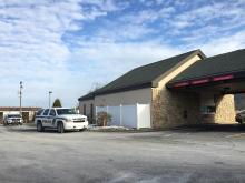 Police SUVs sit to the rear of Santander Bank in Elysburg after a bank robbery was reported Monday. (Press Enterprise/Kristin Baver)