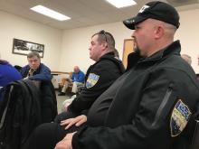 Riverside Police officer and Danville firefighter Brad Harvey addresses commissioners from Columbia and Montour counties Thursday about problems with the merged 9-1-1 center. Next to him is Riverside Police Chief Kerry Parkes.