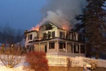 Firefighters work to extinguish a fire at 275 Mountain Road, Berwick, on Thursday morning.