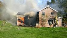 Smoke pours from a house at 193 Toby Run Road, outside of Danville, Wednesday. (Press Enterprise/Jimmy May)