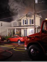 Firefighters work to put out an early-morning blaze at 19 W. Butler St., Shickshinny.