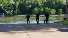 Police, along with Deputy Coroner Ron Taylor (in white shirt), await the arrival of a boat carrying the body of a man found in the Susquehanna River on Thursday. (Press Enterprise/Julye Wemple)