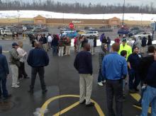 People gather in the parking lot of a car wash at the Buckhorn Plaza during an evacuation of the Walmart on Friday. (Press Enterprise/Jimmy May)