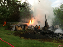 A fire burns at a house on Poplar Road, north of Millville.(Press Enterprise/Bill Hughes)