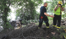 Rescue crews work to pull up a vehicle that crashed into the river near Nescopeck. (Press Enterprise/Keith Haupt)