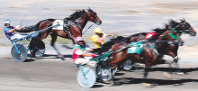 (Press Enterprise/M.J. Mahon) Harness racers and their horses compete Saturday morning on the track at the Bloomsburg Fair.