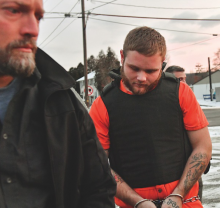 Michael Crimi is led into District Judge Richard Knecht's office in Berwick by Detective Greg Martin, left, and Officer Reagan Rafferty, behind Crimi. (Press Enterprise/Jimmy May)