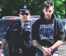Michael Manganello, 26, is taken into District Judge Russell Lawton’s court in Scott Township Tuesday morning by Bloomsburg Officer Matt Golla. (Press Enterprise/Keith Haupt)
