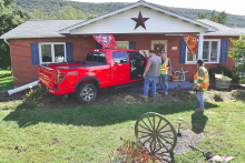 Marlene Kadelock, Harveys Lake, struck a van and then this house after her Ford pickup went off Route 487 near Stillwater on Monday afternoon. (Press Enterprise/Julye Wemple)