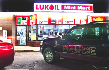 A police SUV is seen outside of Lukoil Mini Mart after a man reportedly held up the store at gunpoint. (Press Enterprise/Bill Hughes)