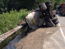 This tanker overturned along Route 487 Monday, spilling tar into Fishing Creek in Orange Township. (Press Enterprise/John-Erik Koslosky)