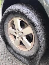Mail carrier Ed Cragle's tires after driving a freshly tar-and-chipped section of Route 239 on Tuesday. (Special to the Press Enterprise/Ed Cragle)