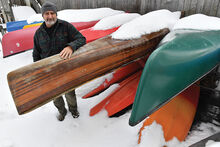 Press Enterprise/Jimmy May Dave Decoteau owner of Riverside Adventure Company stands with some canoes and kayaks at his business in Riverside Tuesday. Decoteau has won a contract to offer watercraft rentals at the Montour Preserve this year.