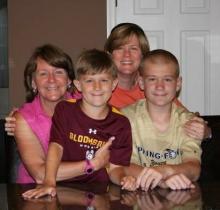 Alicia Terrizzi, left, and Loreen Bloodgood sit with their boys, Blake and Lance.