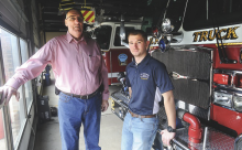Bloomsburg fire chief Bob Rupp, left, and firefighter John Rebovich stand with one of the trucks at the fire station in Bloomsburg. Bloomsburg Fire Department received a grant to reward firefighters who joined the volunteer department.