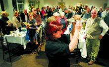 Chef Sharon Duff parades the haggis around the room for patrons