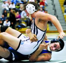 Berwick's Andrew Woznack, bottom, puts Dallas' Aaron Kliamovich on the mat