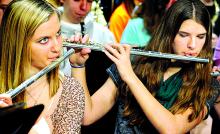 Kaitlynne Crawford, left, Central Columbia, and Alicia Skeath, Berwick, play their flutes