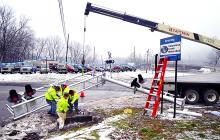 A crew with Diamondback Signal installs a new cantilever signal bridge