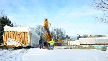 A crew from Zartman Construction readies a crane in place for work to begin to place a new modular building at the site of the South Centre Township Municipal building