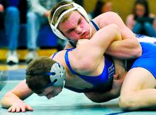 Central's Tyler Johnson, top, controls Warrior Run's Andy Walker during the 138-pound bout Thursday at Warrior Run. 