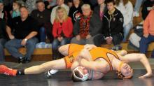 Central Columbia's Austin Miknich, bottom, keeps control of Benton's Jeremy Walsh near the end of the 170-pound match Thursday night at Central. 
