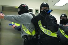 Officers, from left, Ryan Pander of Mahoning Township Police Department, Skylar Truchon and Scott Missman of Loch Haven University work as a team as they move down a hallway during an active shooter training hosted by Commonwealth University-Bloomsburg at Centennial Hall Tuesday morning.