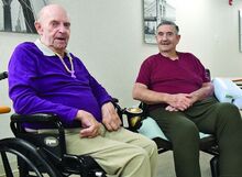 Press Enterprise/Jimmy May High school friends and now roommates at Glen Brook Rehabilitation and Healthcare Center Bill Pegg and John Turner sit together at the center’s dinning room Thursday. 