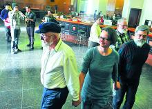 Oliver Larmi, left, Ula Konczewska and Jack Holt dance to the music of the Brookyn based Raya Brass Band during a dance party held Sunday afternoon at the Bloomsburg Moose Exchange.