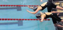 Central Columbia's Cassie Coombe, top, and Mallory Savage leave the starting blocks in the first heat of the 100 breaststroke during Thursday evening's District 4 swimming championships at Williamsport.