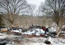 The remains of the house that burned on Monday at 337 Martzville Road, just outside Berwick in Briar Creek Township, have been knocked down and pushed into the basement. A State Police fire marshal has ruled the blaze accidental. 