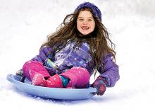 Hannah Bartholomew, 7, Danville, takes a solo ride down Owen Alley in Danville on Wednesday morning.