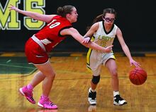 Columbia-Montour Vo-Tech’s Breanna Utt, right, heads up the court as MMI’s Bria Kringe reaches across during the first quarter of Tuesday evening’s game at Vo-Tech. 