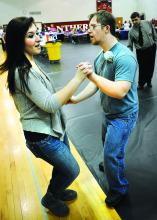 Danny Tloczynski, Bloomsburg, dances with Bloomsburg high school senior Ashlyn Siciliano in the Bloomsburg High School Gymnasium Tuesday at the school's Life Skills Easter Dance.