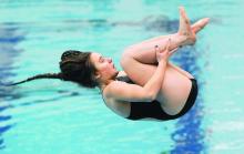 Berwick diver Amanda O'Kane tucks her legs into her chest.