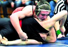 Benton's Zain Retherford, top, turns Bucktail's Demetri Probst onto his back for points in a 138-pound semifinal match Saturday in Williamsport.