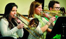 Trombonists, from left, Caroline Santos, Danville; Laura Spence, Berwick; and Evan Saunders, Nanticoke, rehearse