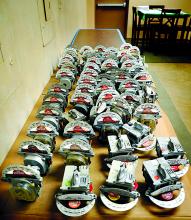 Parking meters with the covers removed are gathered on a table in the Shickshinny borough hall