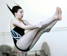 Central Columbia's Emma Padner prepares to release her legs and look for the water during the diving event against Danville Tuesday afternoon at the Danville Area Community Center.