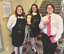 Columbia-Montour Vo-Tech students, from left, Sophia Cornell, Macanzie-Snow Boggs and Haylee Fisher were competing as one of the dozen teams from the Academy of Young Entrepreneurs from the For The Cause teen center at the 7th Annual Husky Dog Pound Competition Thursday morning. They were pitching a tool they designed to make cutting hair easier. 