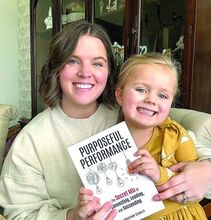 Taylor Dinelli and her daughter Ella bought a copy of Purposeful Performance Saturday from author Johnathan Stanley at a book signing in Wiles-Barre. A TikTok video the Berwick PA made of the meeting with Stanley went viral. 