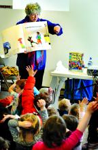 Suzanne Bloom, author and illustrator of children’s picture books, reads from an oversize copy of her book “The Bus for Us” and answers questions from preschoolers during a visit to the Thomas Beaver Free Library in Danville.