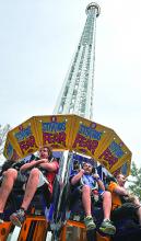 Michael Bonner, left, and Jonathan Rosetta react as they drop to the bottom of the StratosFear, the new thrill ride at Knoebels on Sunday. 