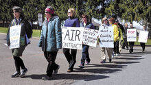 Danville Intermediate School teachers walk a picket line along Liberty Valley Road on Thursday morning.