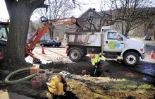 United Water workers repair a broken eight-inch water main at the corner of Old Berwick Road and Tenny Street in Espy on Monday morning.