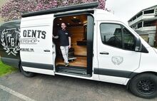Press Enterprise/Jimmy May True Gents Barbershop owner Brent Robinson has put together a van which two chairs along with counter and sink allowing his business to come to you. 