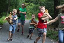 “The kids decided to have a ‘chicken run’ one afternoon,” says photographer Megan Allen of Berwick of her contest-winning photo. “Instead of racing just the chickens, they all ran holding them.” 